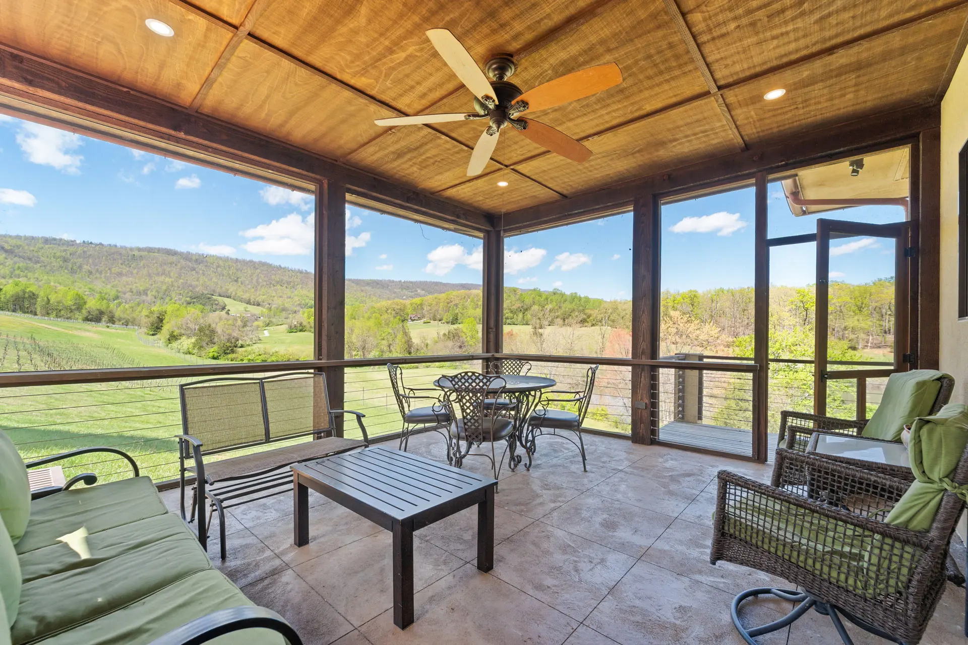 Surrounded by chairs, offering scenic mountain views outside.